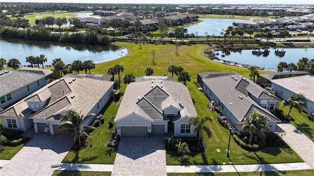 birds eye view of property featuring a water view