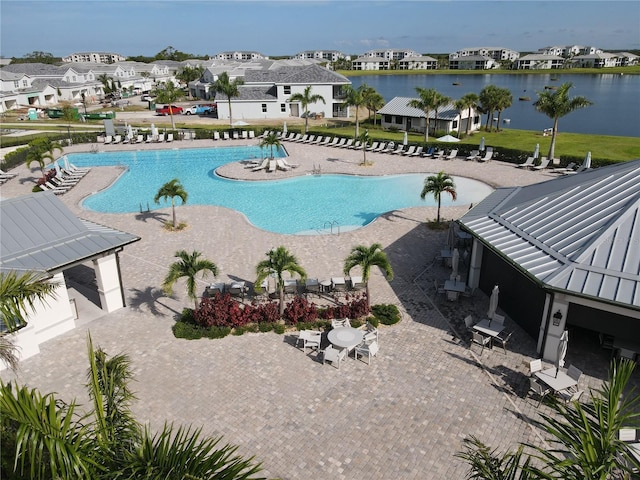 view of pool featuring a patio, a gazebo, and a water view