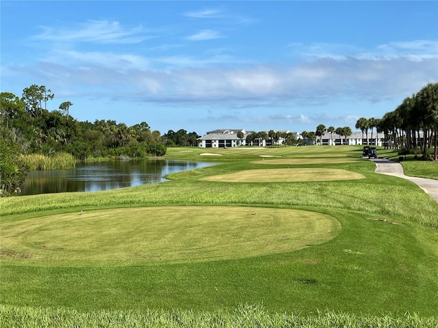 surrounding community featuring a yard and a water view