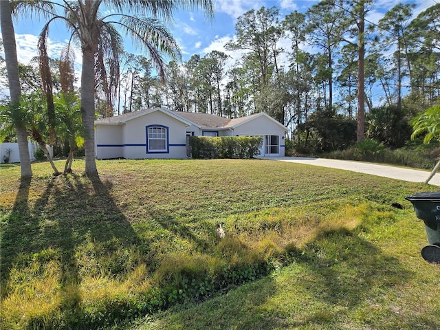 single story home featuring a front lawn