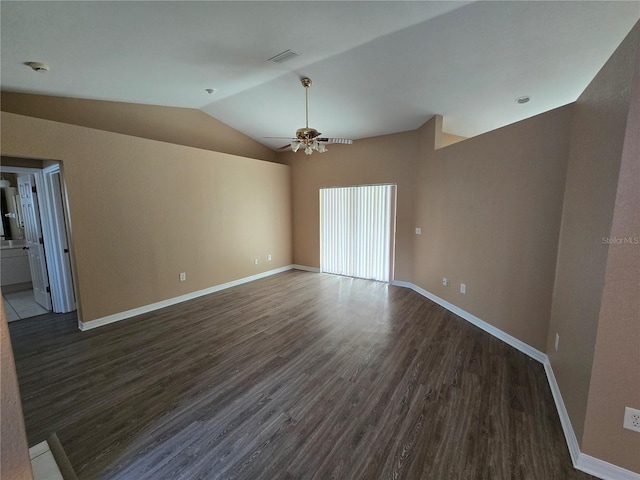 empty room with ceiling fan, dark wood-type flooring, and lofted ceiling