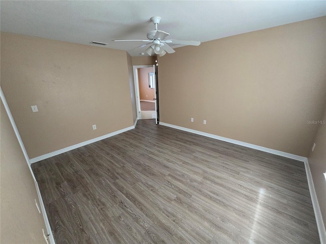 unfurnished room with hardwood / wood-style floors