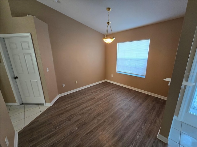 spare room with hardwood / wood-style floors