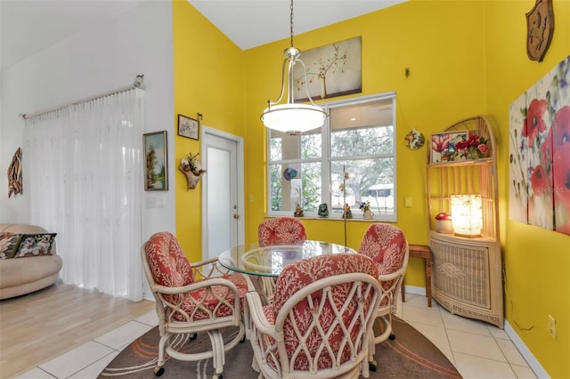 dining space with light tile patterned flooring