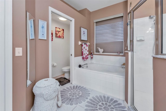 bathroom featuring tile patterned flooring, separate shower and tub, and toilet