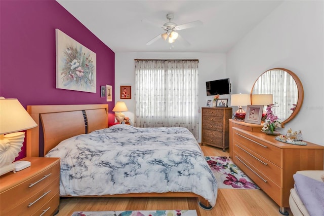 bedroom featuring ceiling fan and light hardwood / wood-style floors