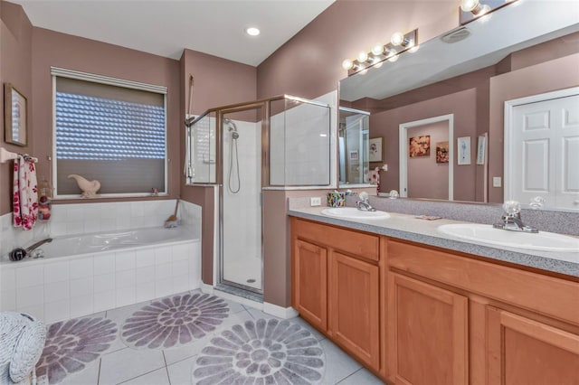 bathroom featuring vanity, separate shower and tub, and tile patterned floors