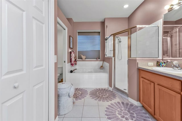 full bathroom featuring tile patterned flooring, vanity, separate shower and tub, and toilet