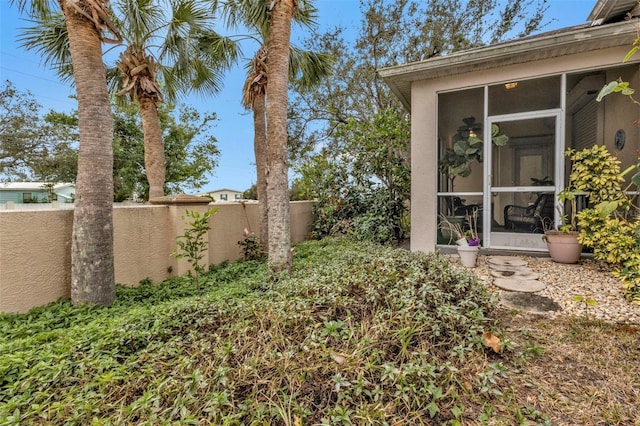 view of yard featuring a sunroom