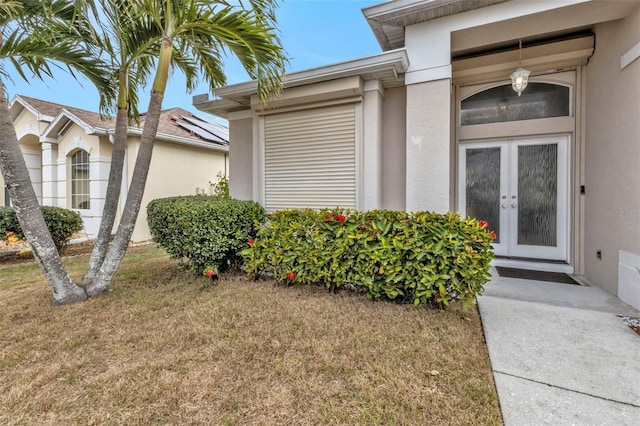 doorway to property with a yard