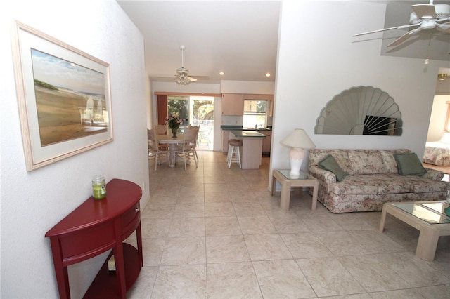 tiled living room featuring ceiling fan