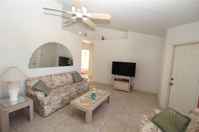 living room with lofted ceiling, ceiling fan, and light tile patterned floors