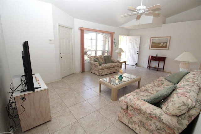 tiled living room featuring ceiling fan and vaulted ceiling