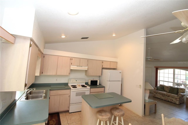 kitchen featuring sink, vaulted ceiling, white appliances, a kitchen bar, and light brown cabinetry