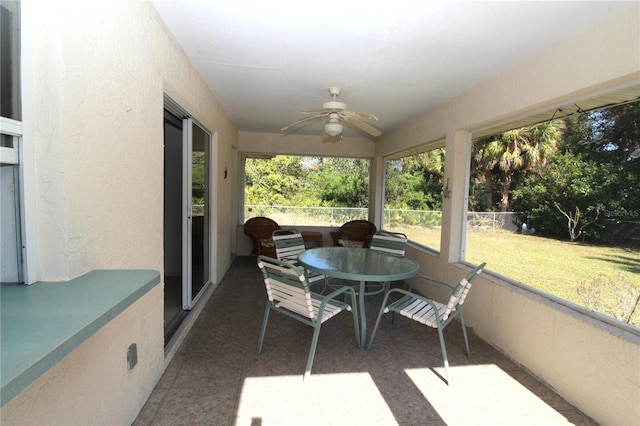 sunroom / solarium with ceiling fan