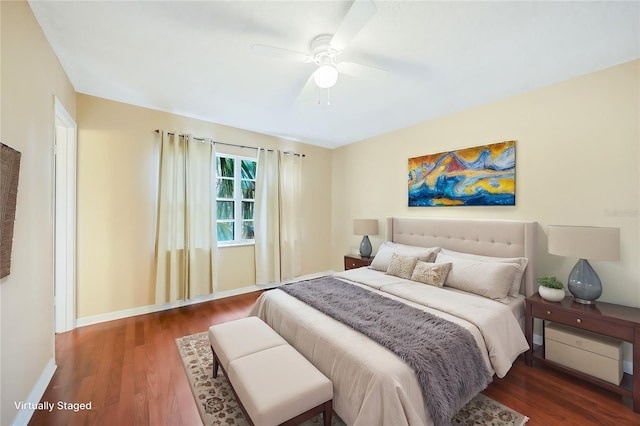 bedroom featuring dark hardwood / wood-style flooring and ceiling fan