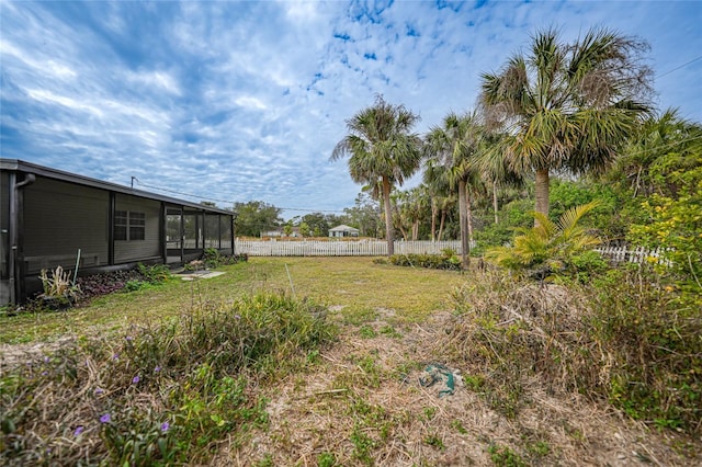 view of yard featuring a sunroom