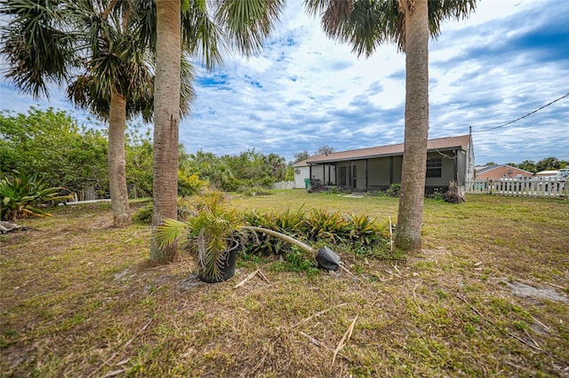 view of yard with a sunroom