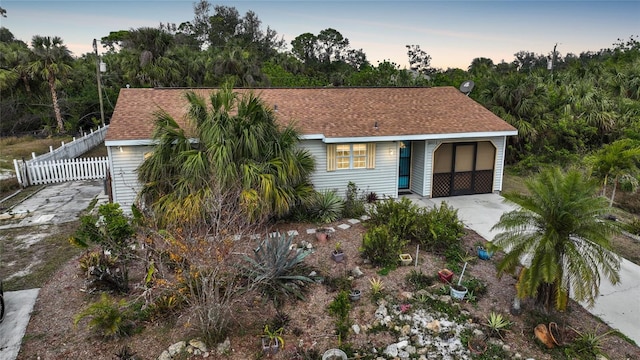 view of front of home featuring a carport