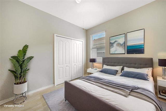 bedroom featuring a closet and light wood-type flooring