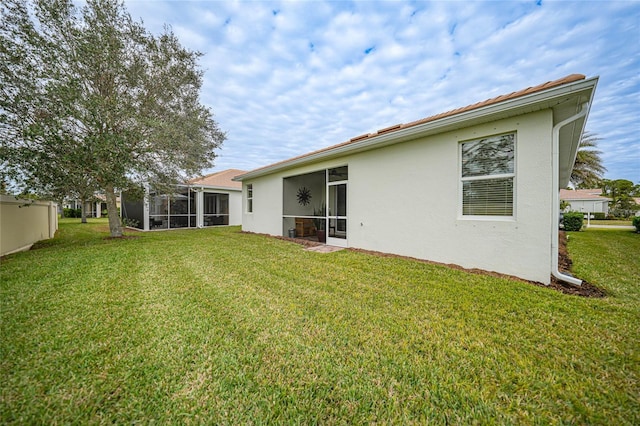 back of house featuring a yard