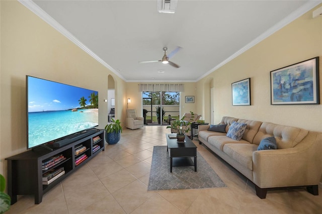 tiled living room featuring ceiling fan and ornamental molding