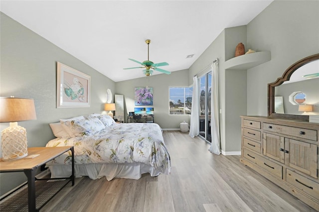 bedroom featuring ceiling fan, light wood-type flooring, access to outside, and vaulted ceiling