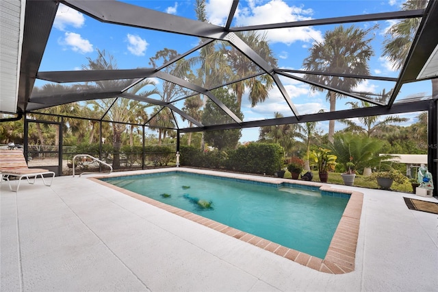 view of pool with a lanai and a patio