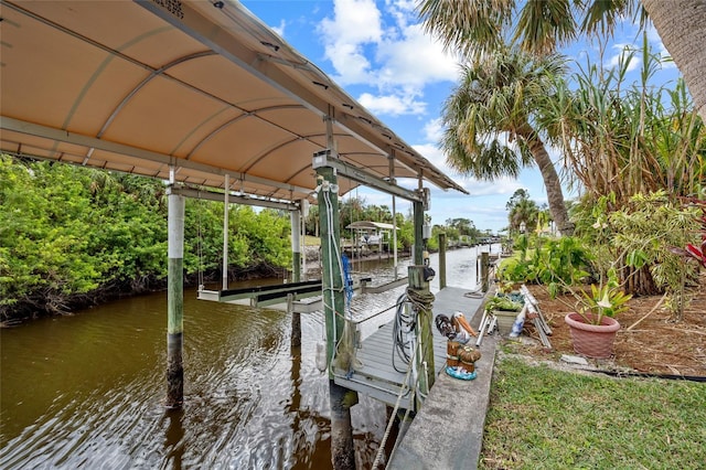 dock area featuring a water view and boat lift