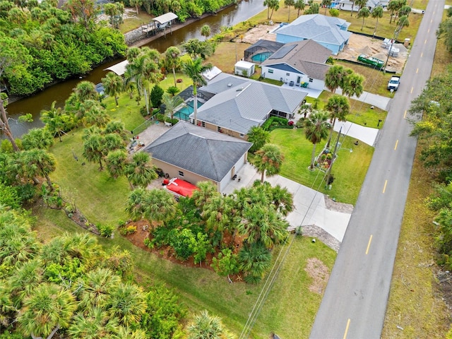 birds eye view of property with a residential view and a water view