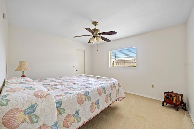 bedroom featuring carpet flooring, a ceiling fan, and baseboards