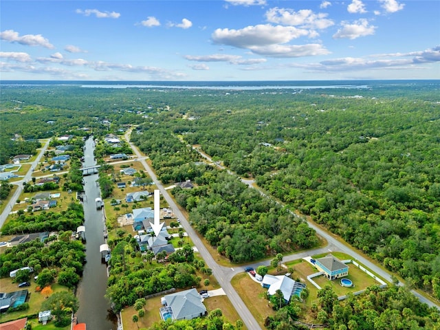 aerial view featuring a wooded view