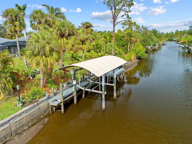 dock area with a water view and boat lift