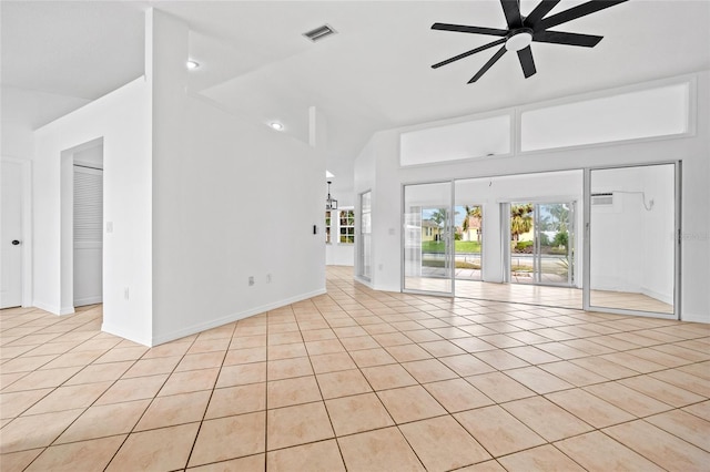 unfurnished living room featuring ceiling fan, light tile patterned floors, and lofted ceiling