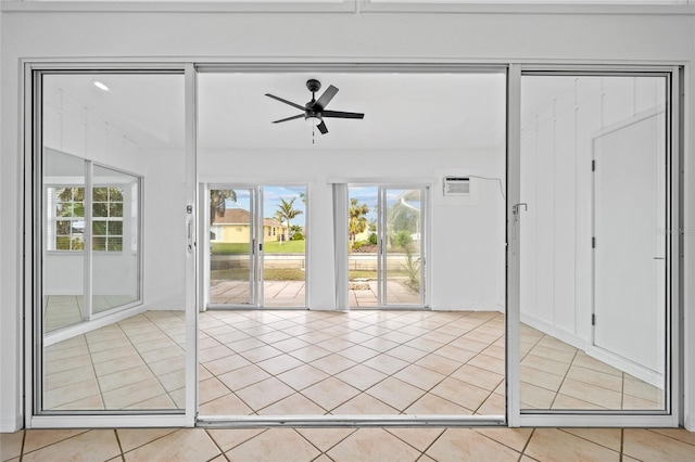 interior space featuring ceiling fan and light tile patterned flooring