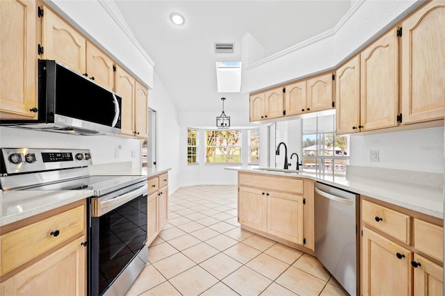 kitchen with light tile patterned floors, light brown cabinetry, sink, and stainless steel appliances