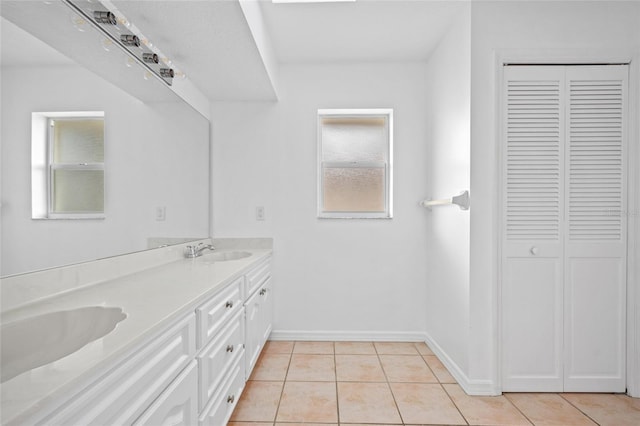 bathroom with tile patterned flooring and vanity