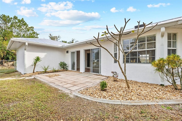 rear view of house featuring a patio