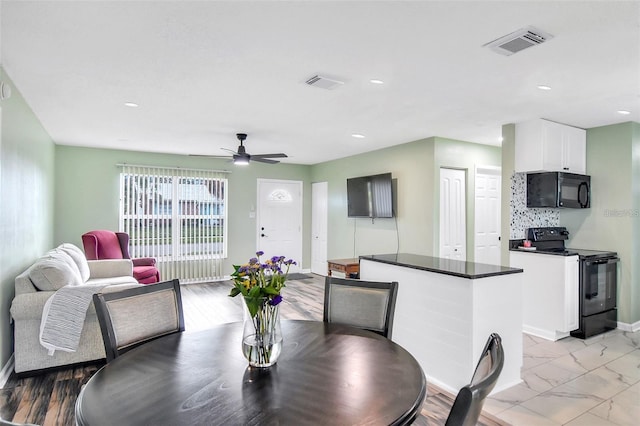 dining space with ceiling fan