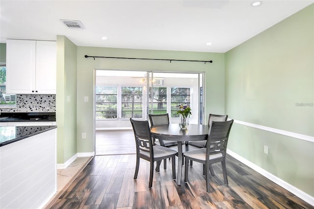 dining area with dark wood-type flooring