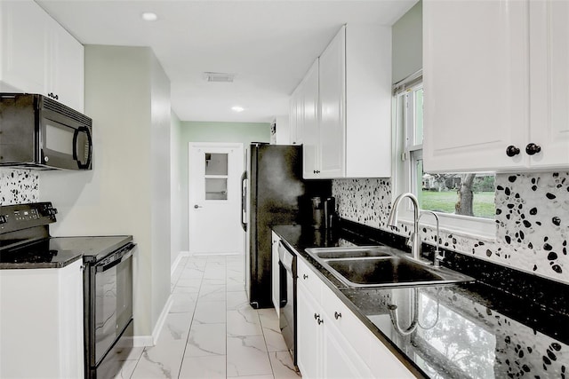 kitchen featuring decorative backsplash, sink, white cabinets, and black appliances