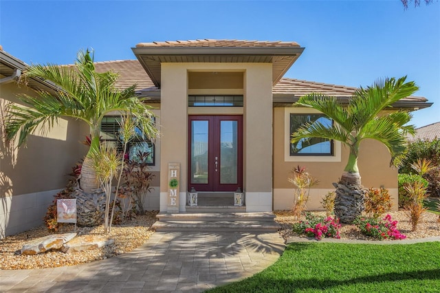 entrance to property featuring french doors