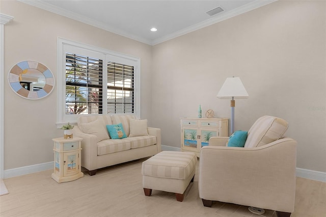 sitting room featuring crown molding