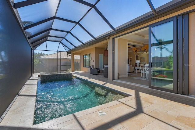 view of swimming pool with a patio area and glass enclosure