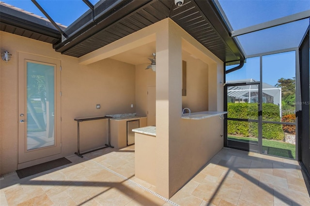 view of patio with a lanai and ceiling fan