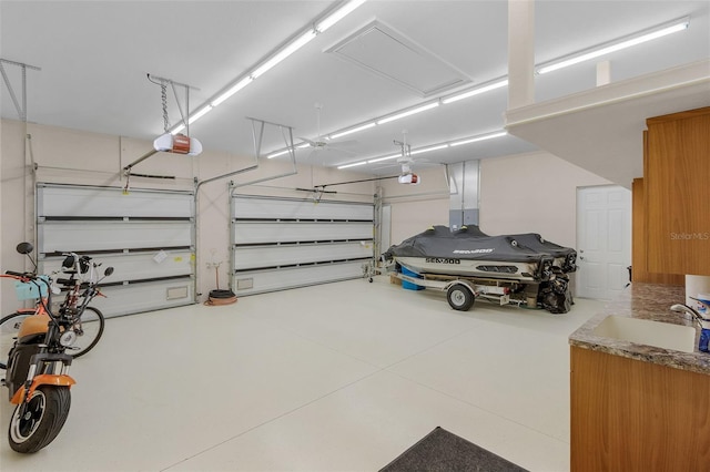 garage with sink and a garage door opener