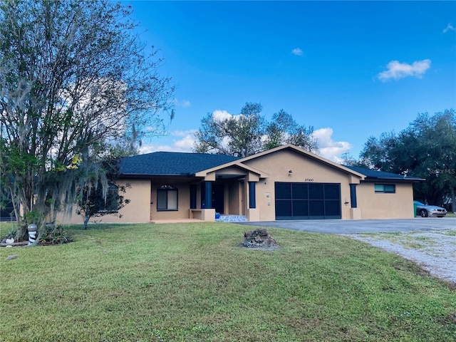 single story home with a front lawn and a garage