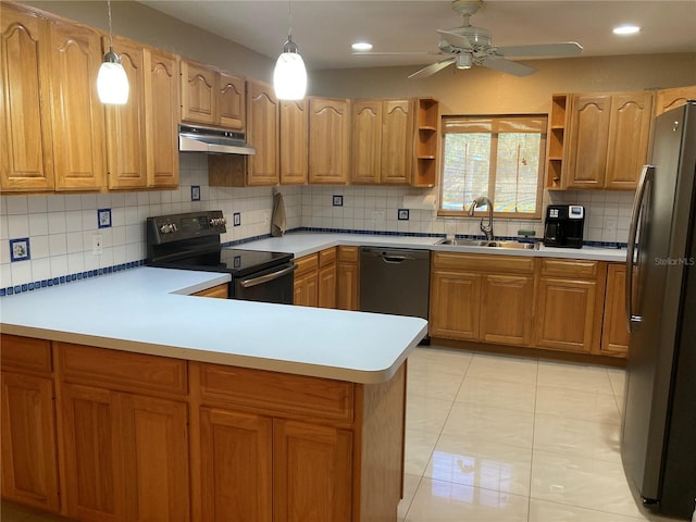 kitchen with pendant lighting, dishwashing machine, black range with electric cooktop, sink, and stainless steel refrigerator