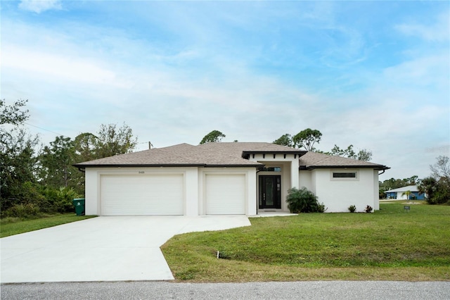 view of front facade featuring a garage and a front lawn