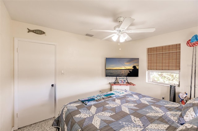 bedroom with ceiling fan and carpet